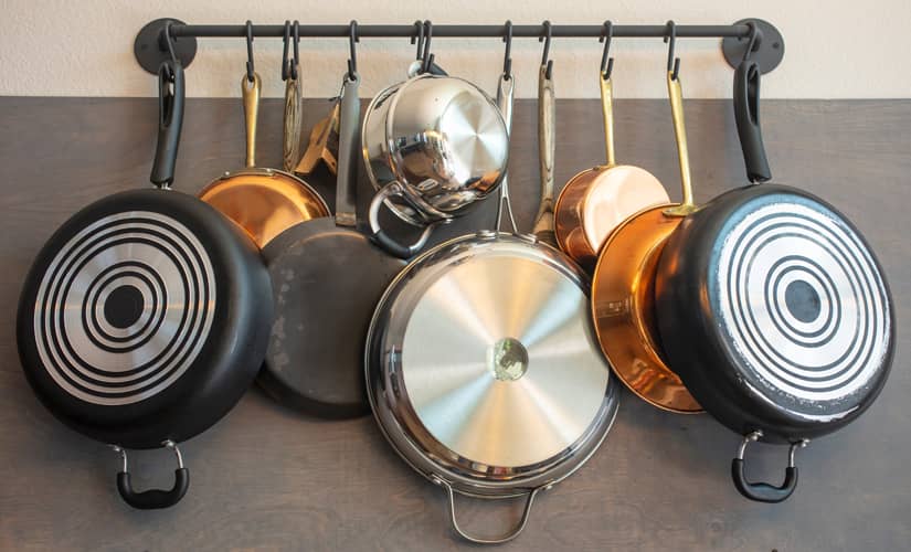 Rack with pots and pans hanging.