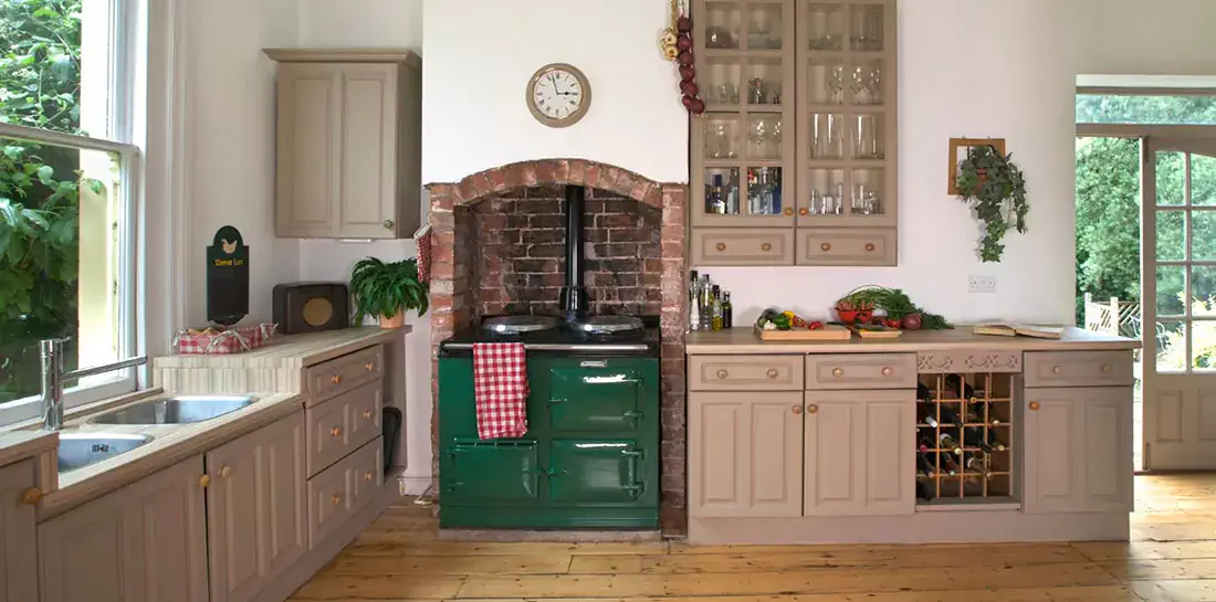 Emerald green vintage stove in farmhouse kitchen.