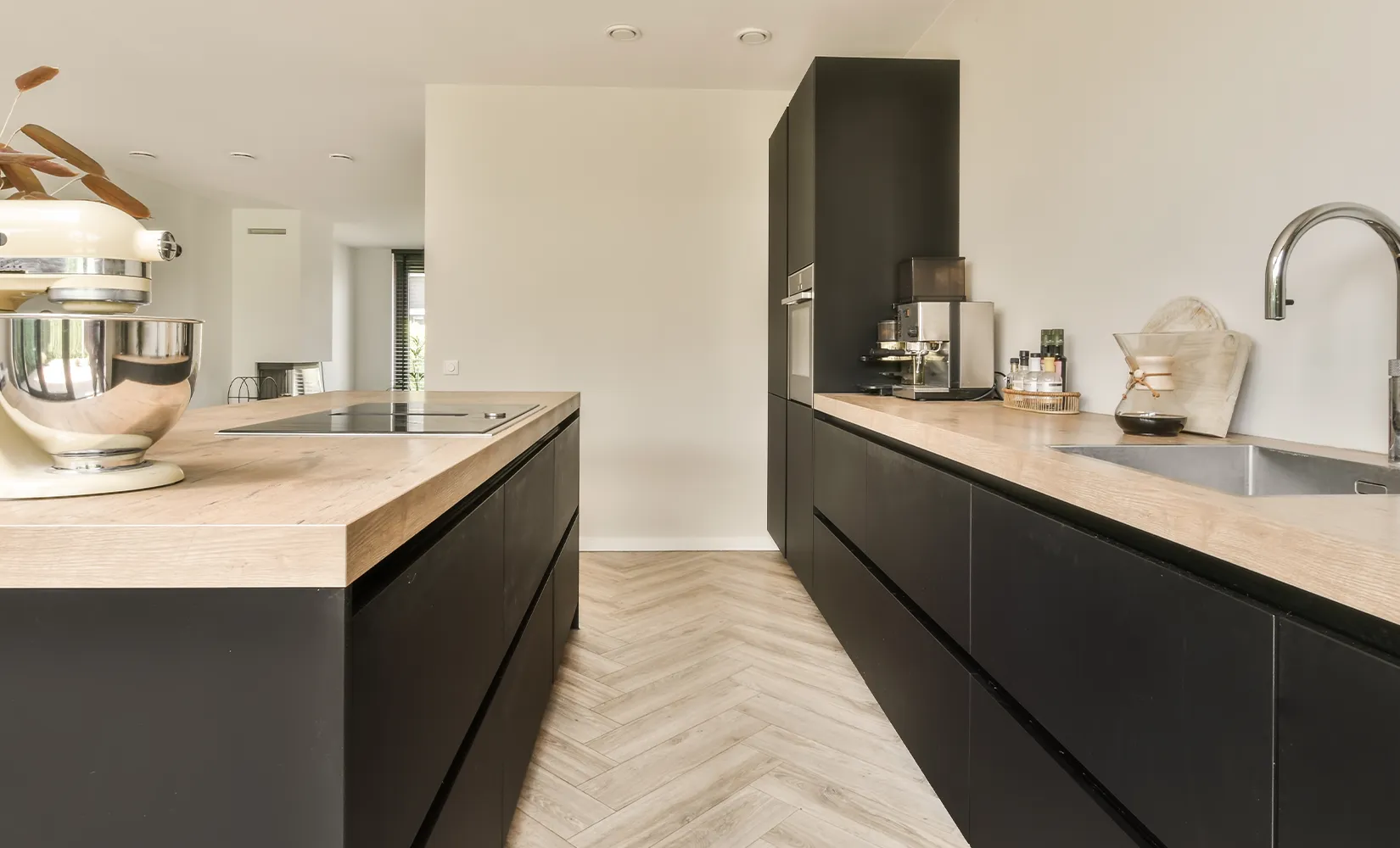 Galley kitchen with stovetop installed in the kitchen island.