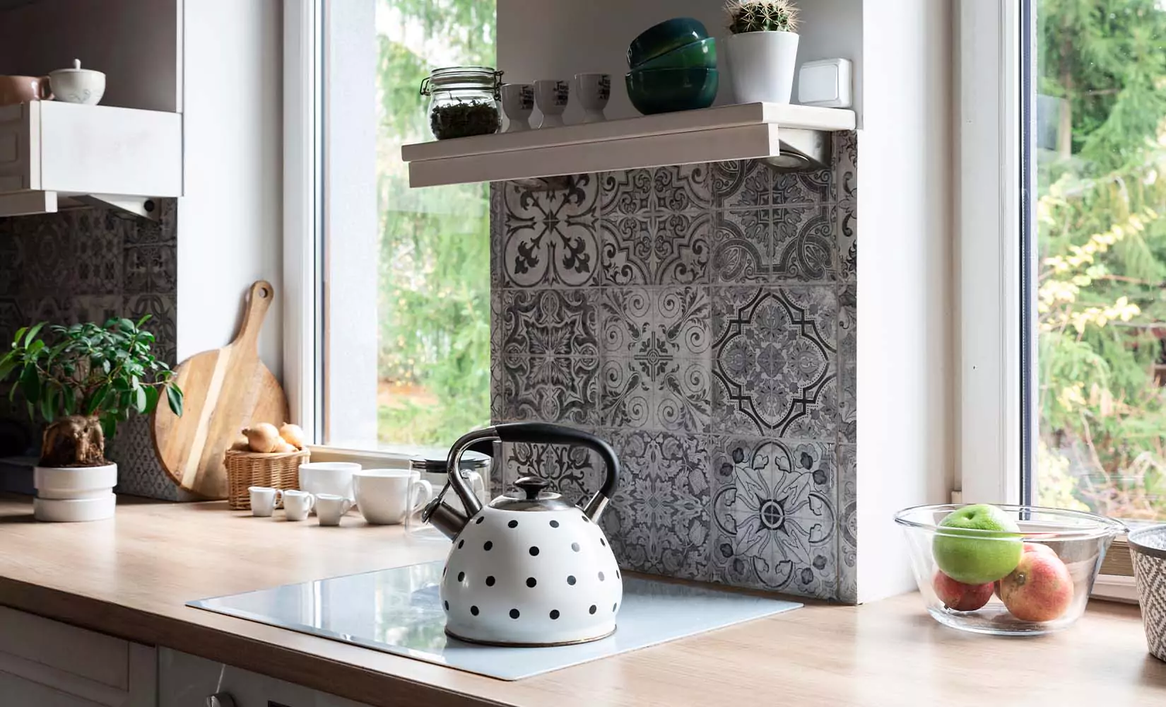 Gray cottage kitchen with gray Moroccan tile backsplash.