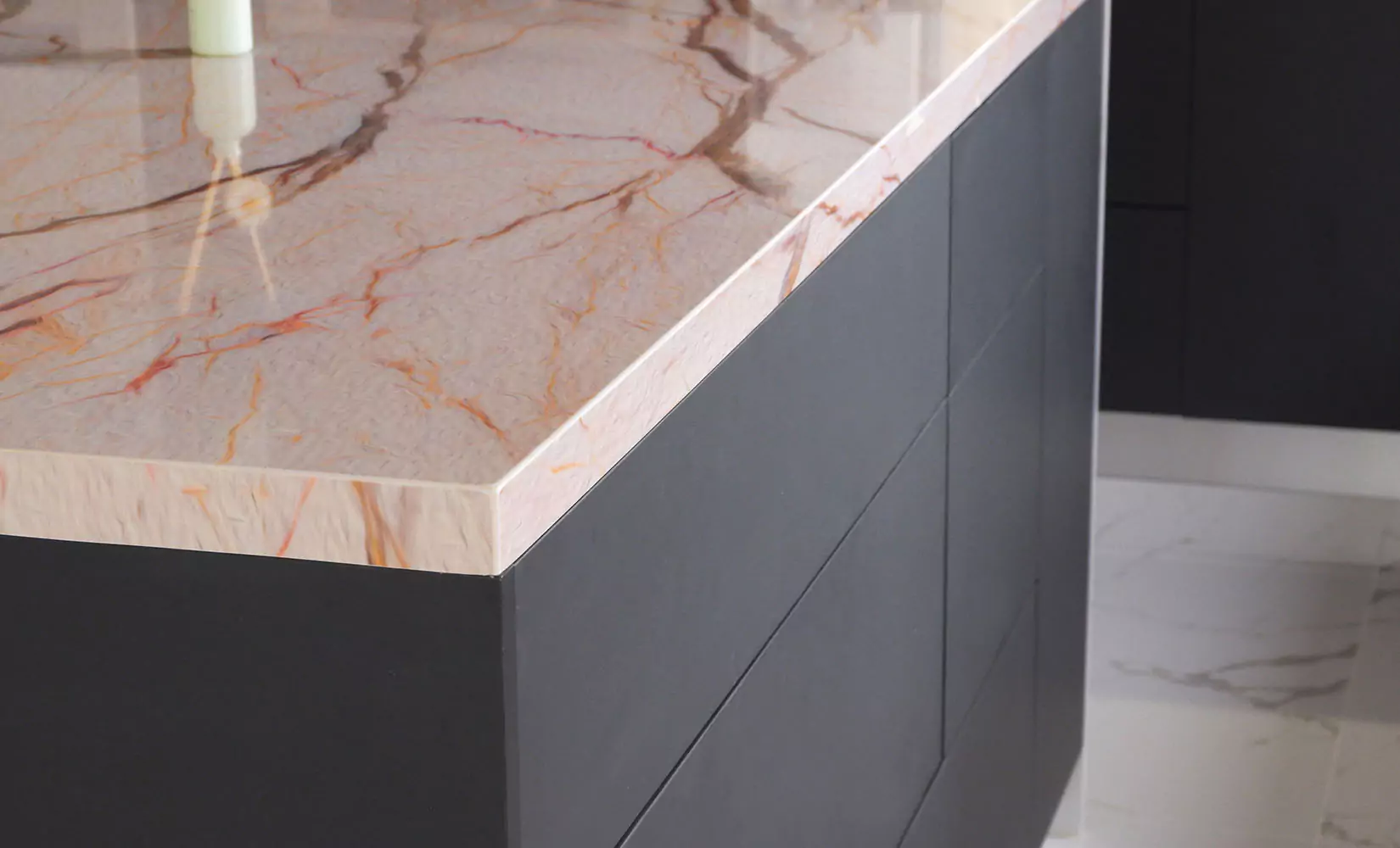 Gray cabinets with rose quartz countertop.