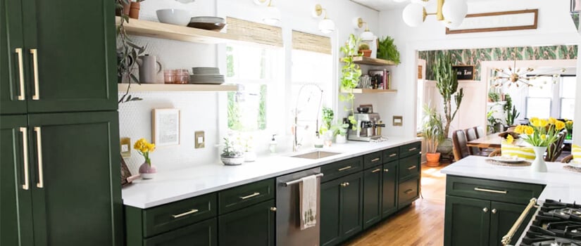 Kitchen with green cabinets and wood accent tones