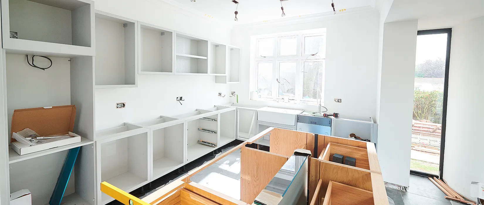 Modern light-filled kitchen under construction.