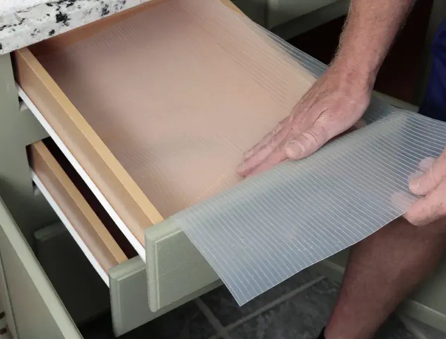 Kitchen cabinet drawer with a liner.