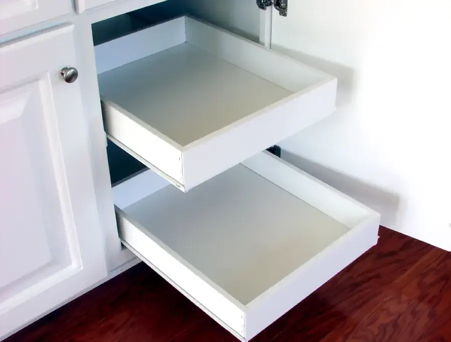 White pull-out shelves in kitchen.