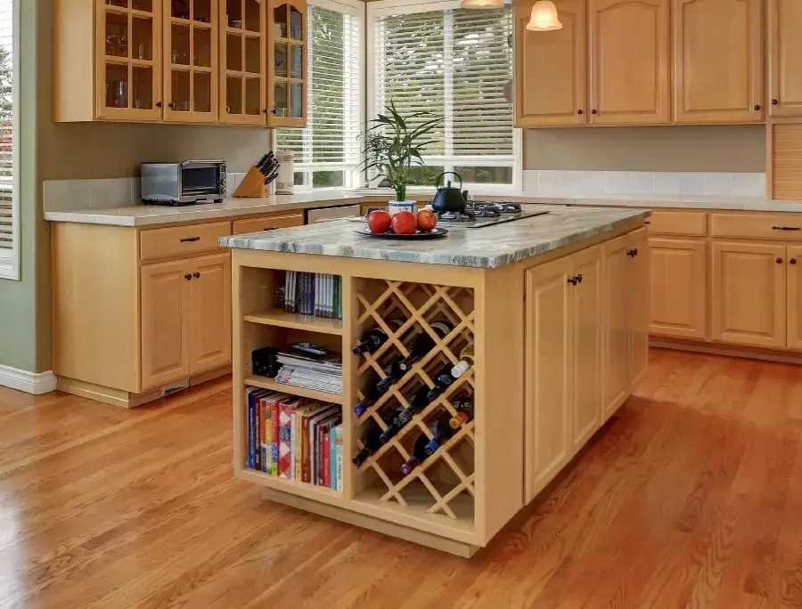 Wine bottle organizer inside kitchen cabinet.