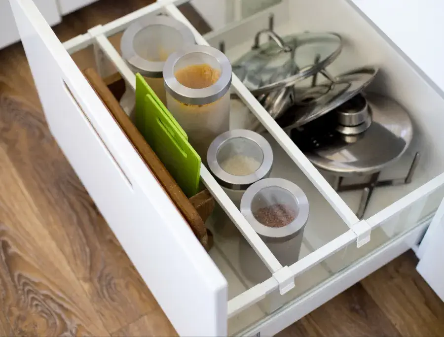 Dividers inside a kitchen cabinet.