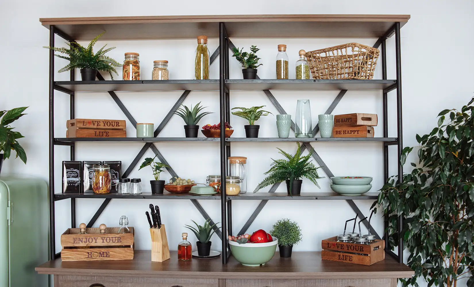 Metal bracket shelves with kitchen supplies sitting on top.