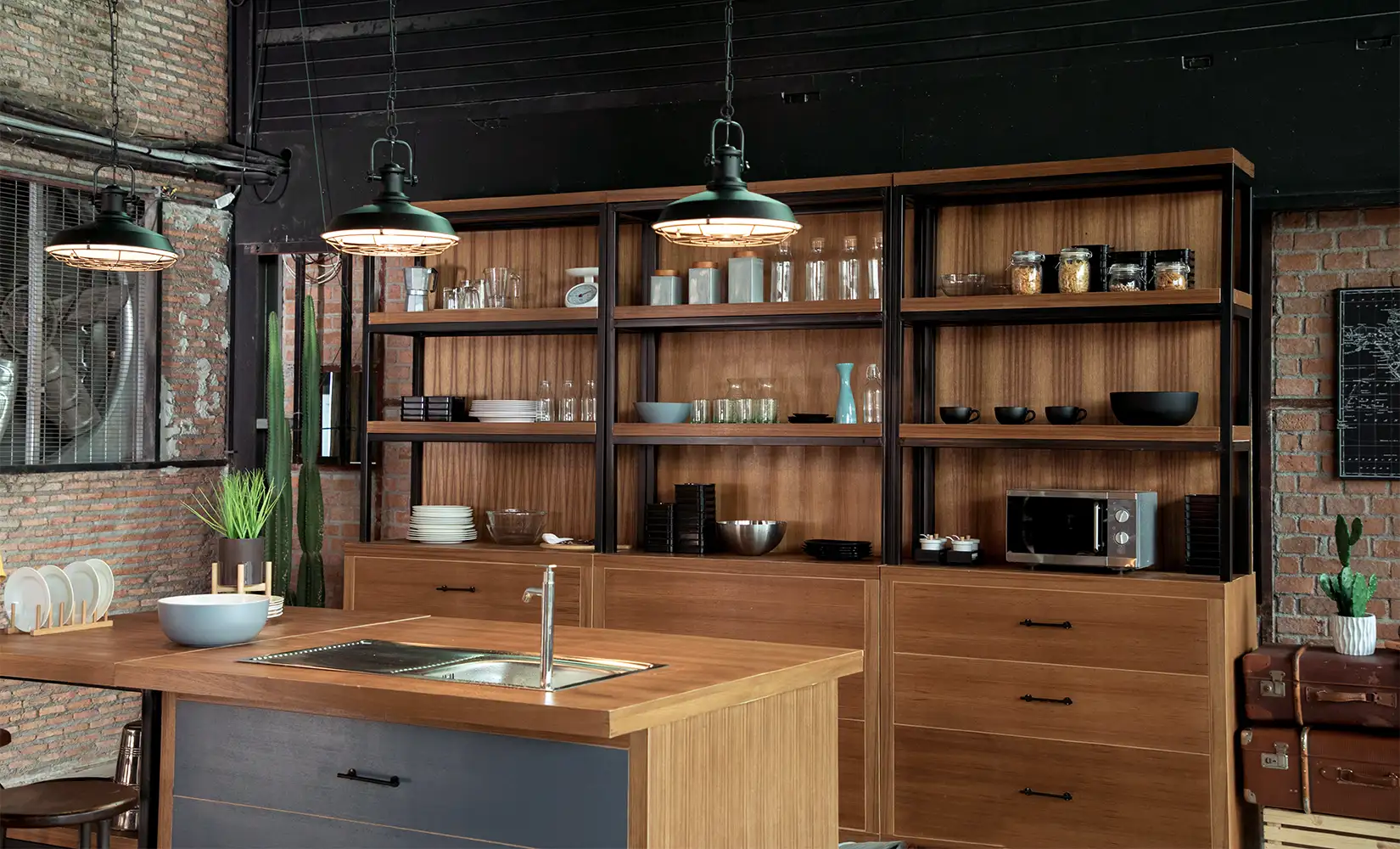 Modern industrial kitchen with hanging light fixtures, wooden shelving, and industrial kitchen decor.
