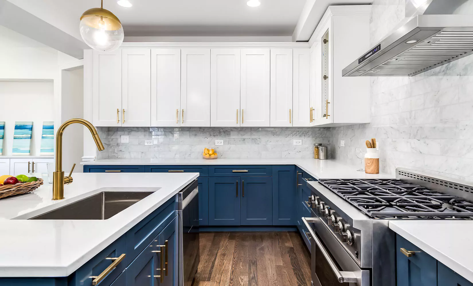 Large modern kitchen with navy blue island and lower cabients and white upper cabinets.