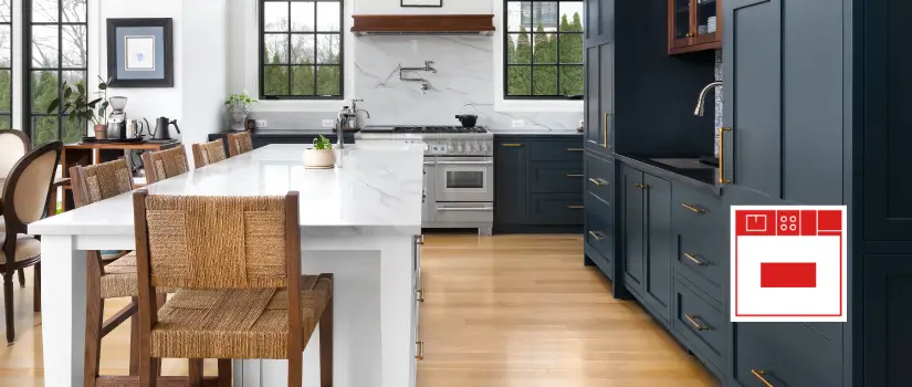  Transitional kitchen with navy blue wall cabinet unit and large white marble kitchen island.