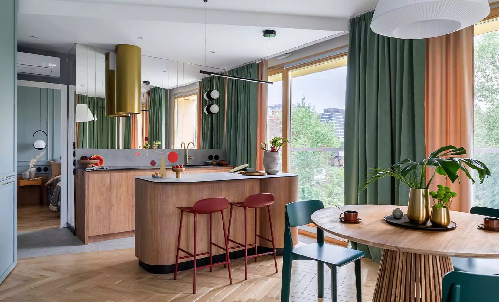 Small colorful kitchen with bright red kitchen island barstools.