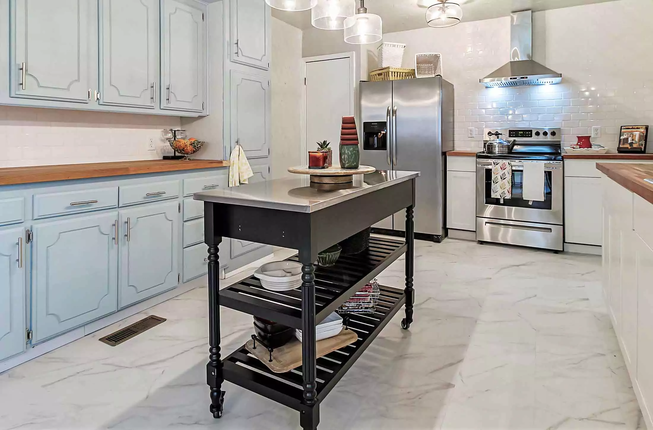 Kitchen with vintage sidetable as island.