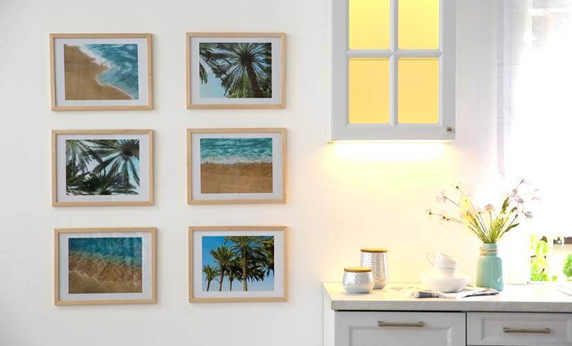 6 photos of beach landscapes on kitchen wall