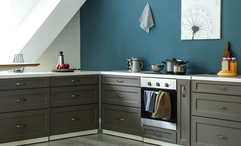 Blue accent wall in neutral-colored kitchen