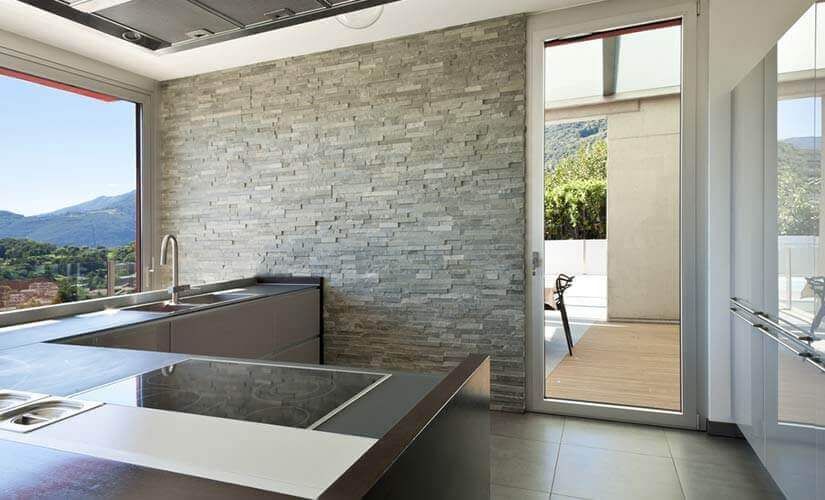 layered stone accent wall in kitchen