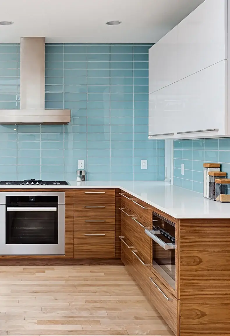 Blue kitchen backsplash with horizontal tiles.