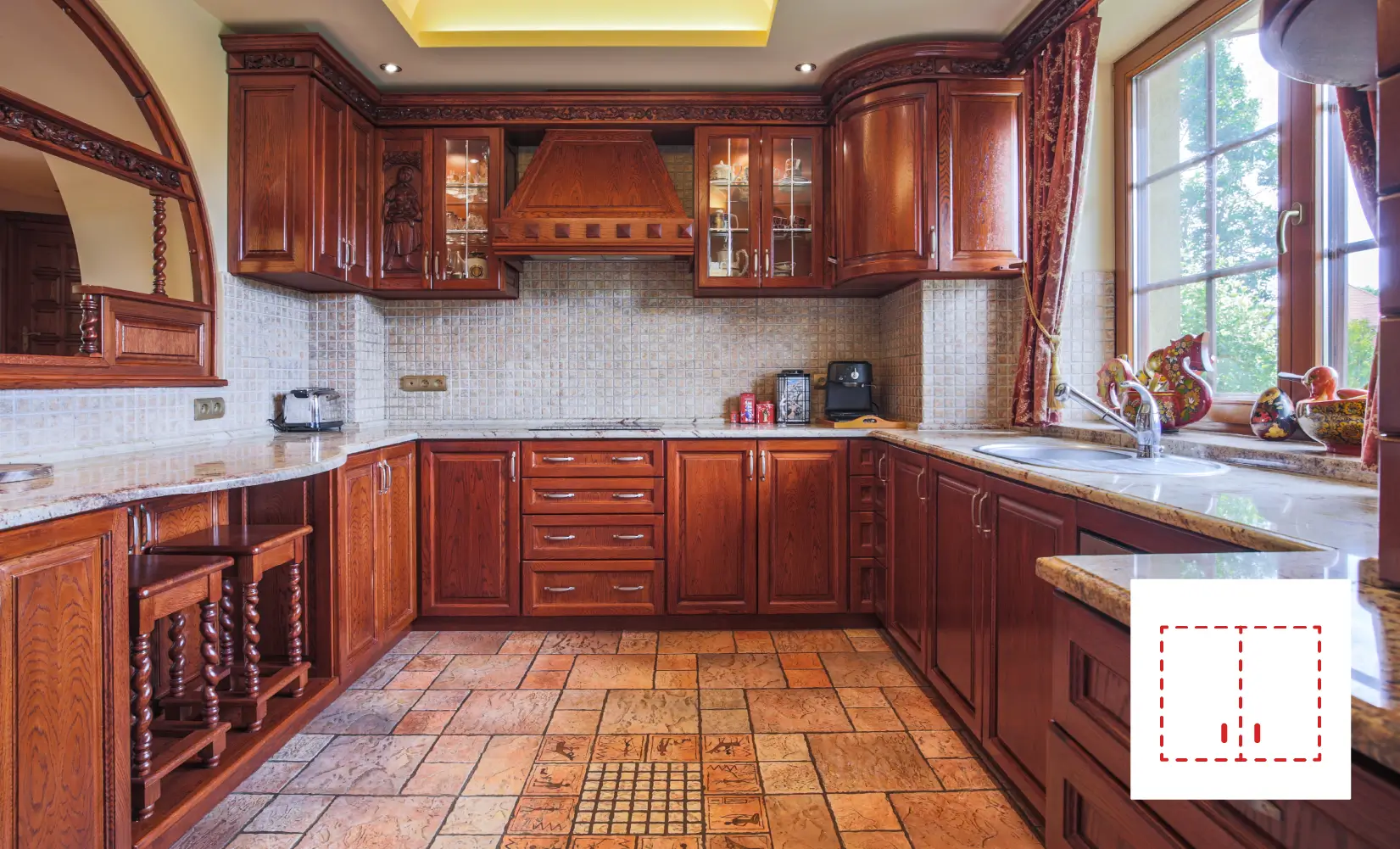 Kitchen with ornate wood custom cabinets.