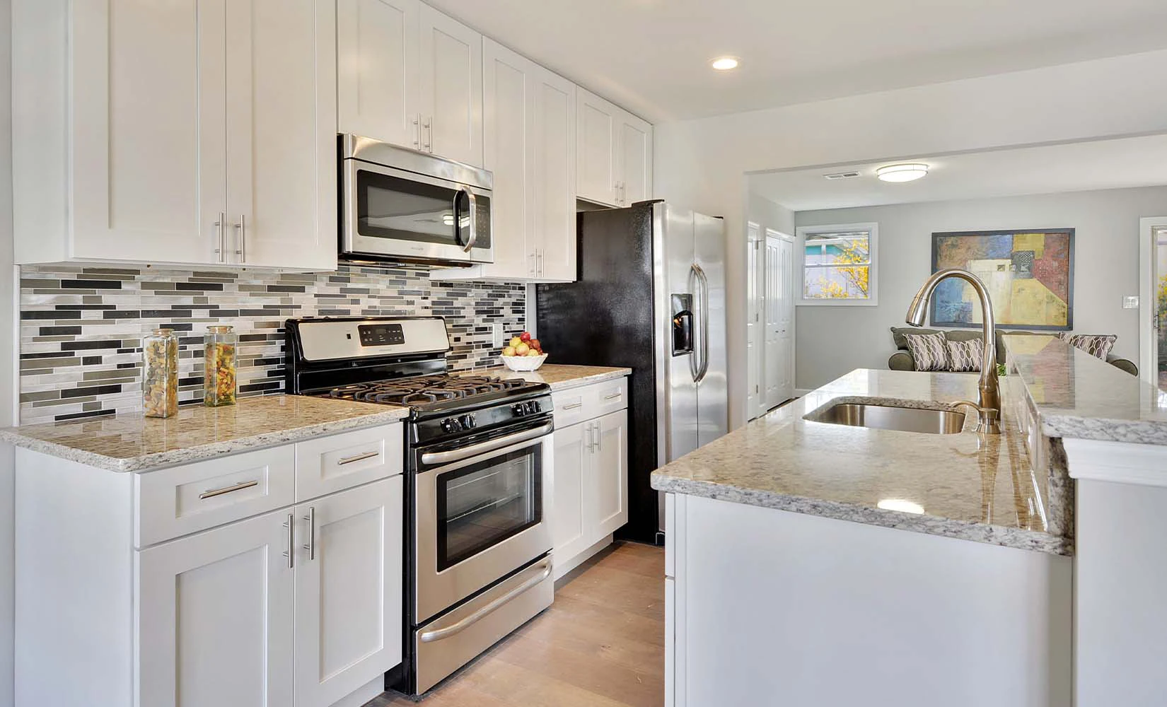 Kitchen with ice white shaker cabinets from Kitchen Cabinet Kings.