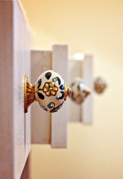 Colorful knobs on open drawers.