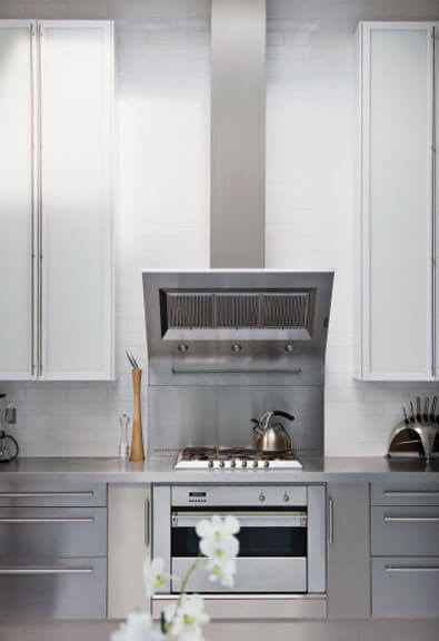 Full length silver pulls in modern kitchen.