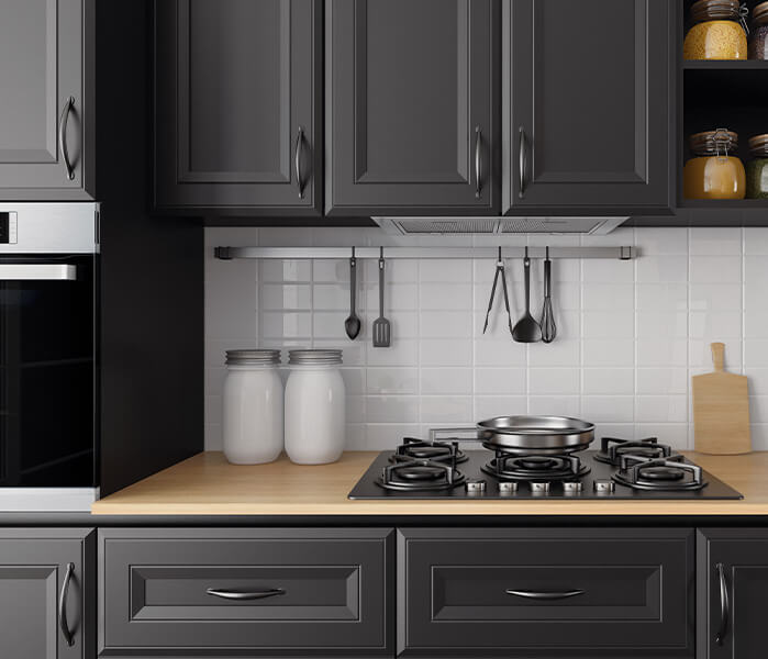 Modern kitchen with black raised panel cabinets, white subway tile backsplash and open cabinet shelving