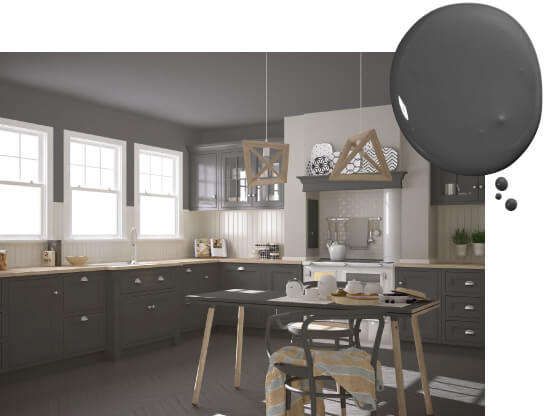 Kitchen with dark gray painted cabinets and ceiling and wood cage pendant lights over gray dining table.