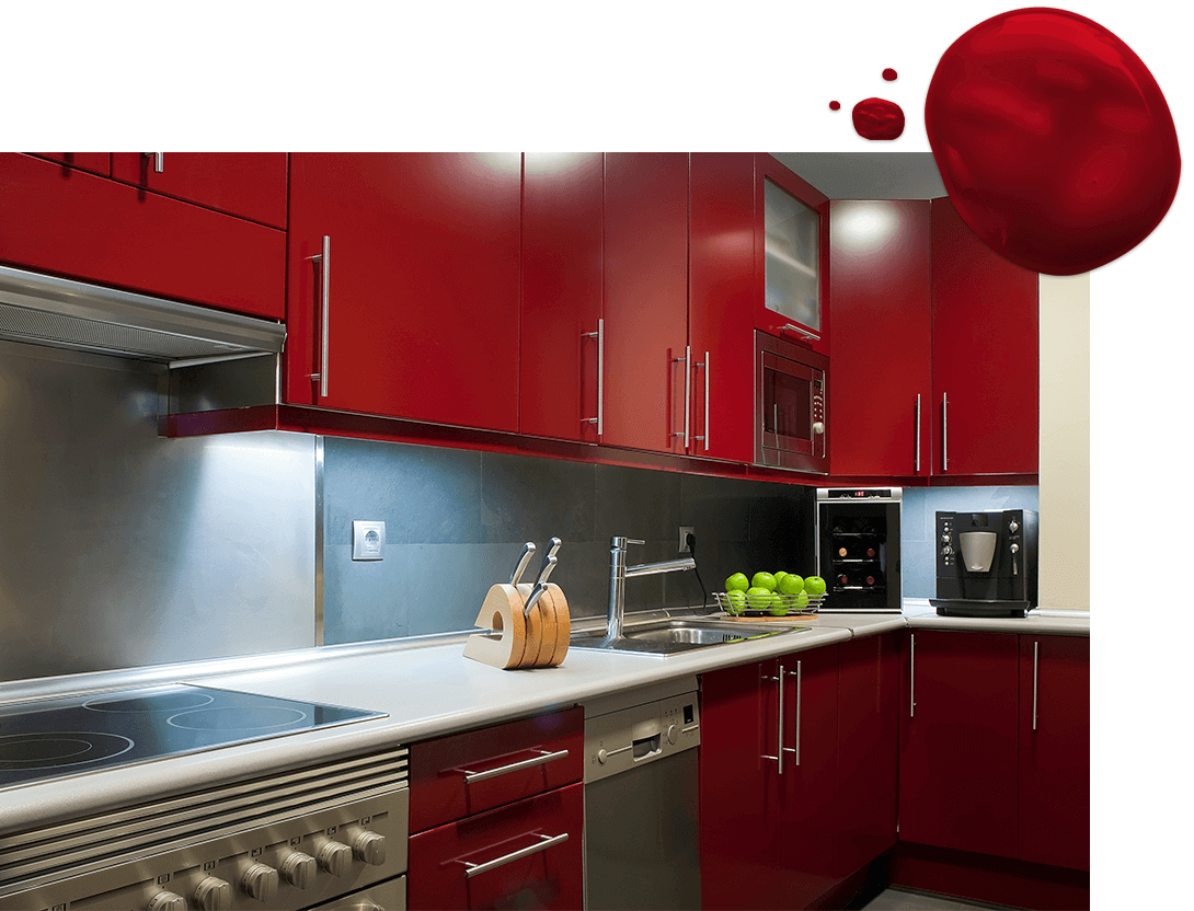 Kitchen with bright red cabinets with modern stainless steel hardware and appliances.