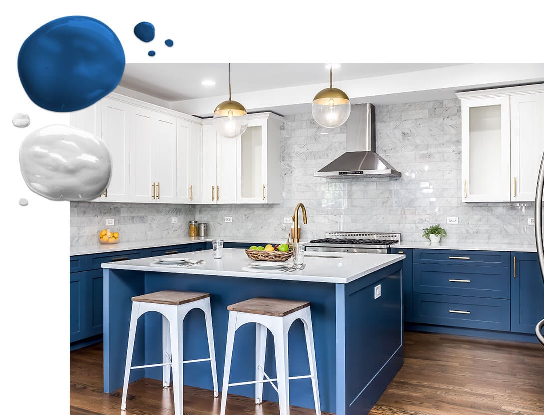 Kitchen white upper cabinets and bright blue lower cabinets with kitchen island and marble tile backsplash.