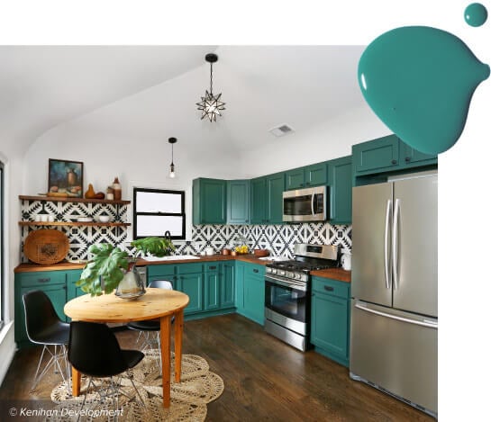 Small kitchen with teal painted cabinets, butcher block countertops and Moroccan-inspired tile backsplash.