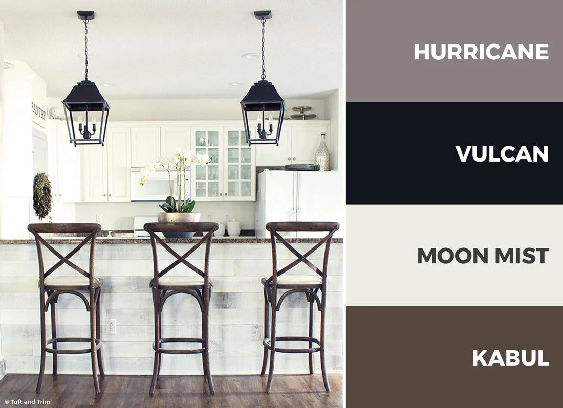  This white, brown, and black kitchen color scheme creates a warm rustic overtone perfect for a modern farmhouse kitchen.