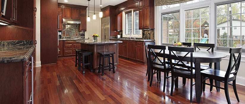 Luxury home kitchen with Brazilian cherry flooring and cabinets.