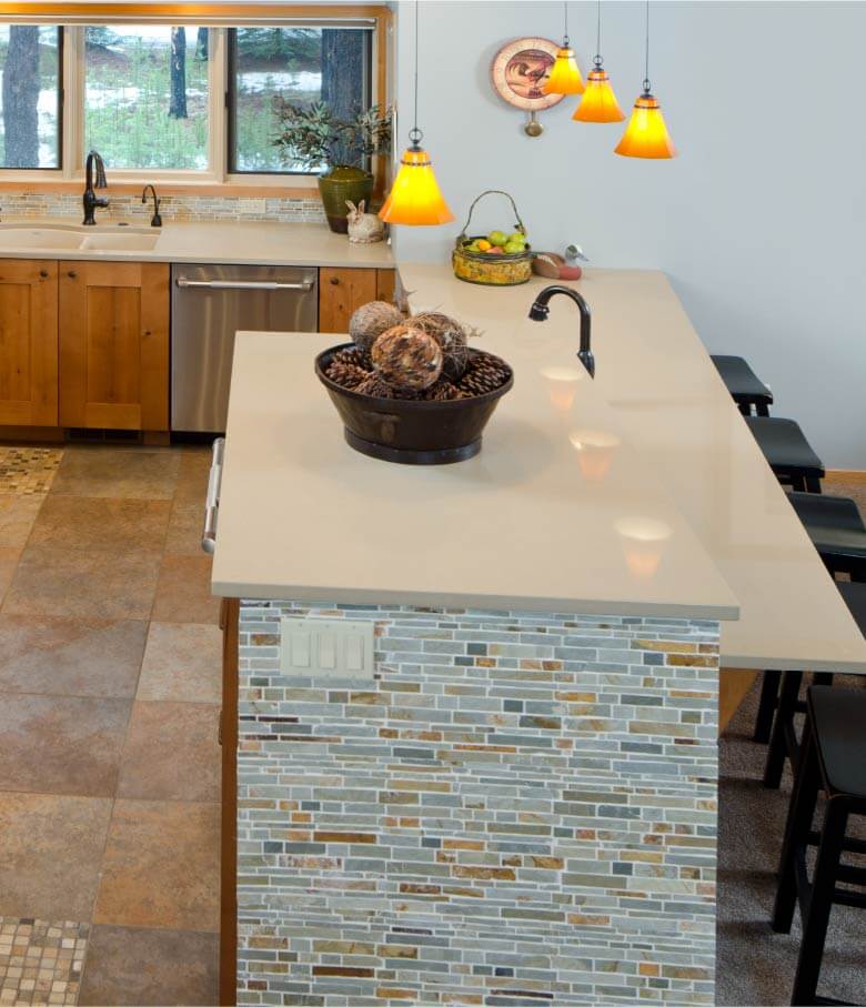 Kitchen island with detailed tile.
