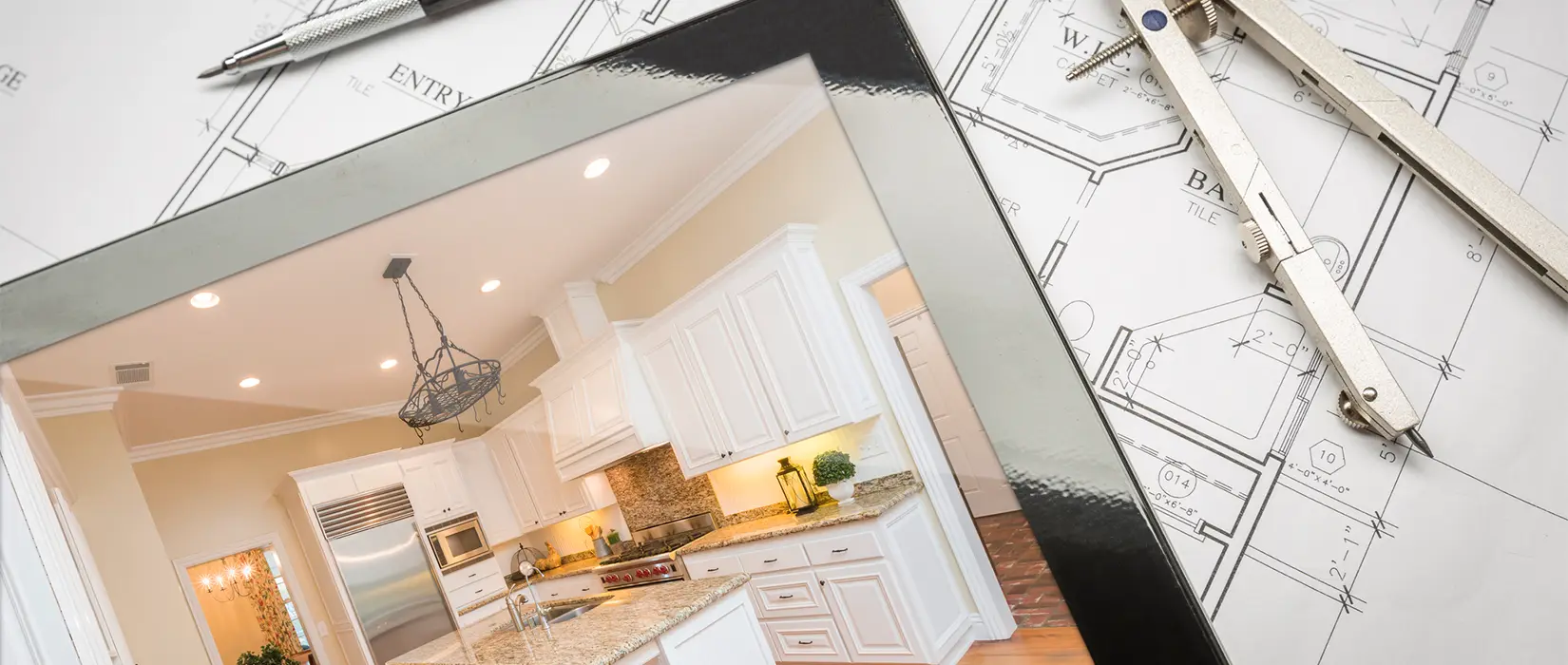 One-wall kitchen layout with black cabinets and large black marble island.