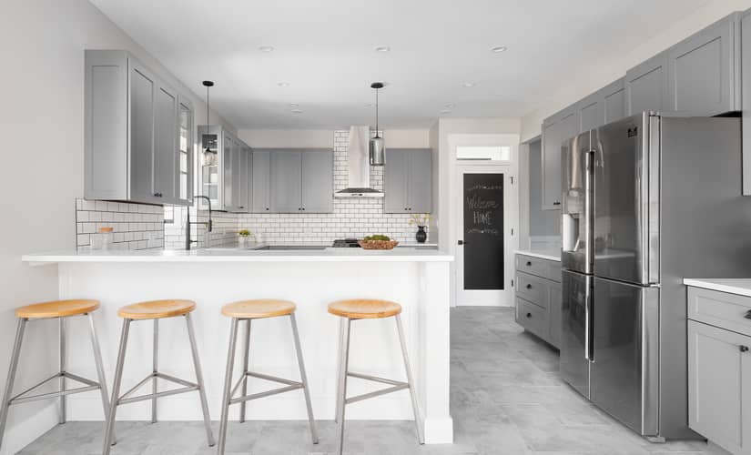 A kitchen update with two-toned white and silver accents