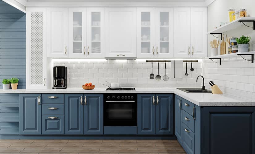 This kitchen design features white and blue kitchen cabinets.