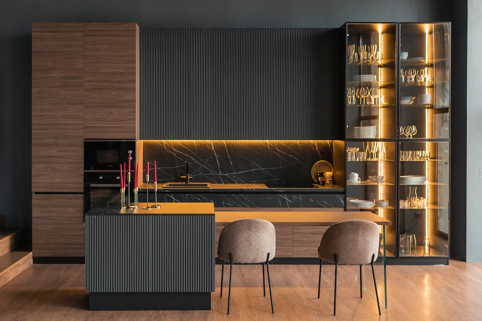 Modern kitchen island with built-in seating area.
