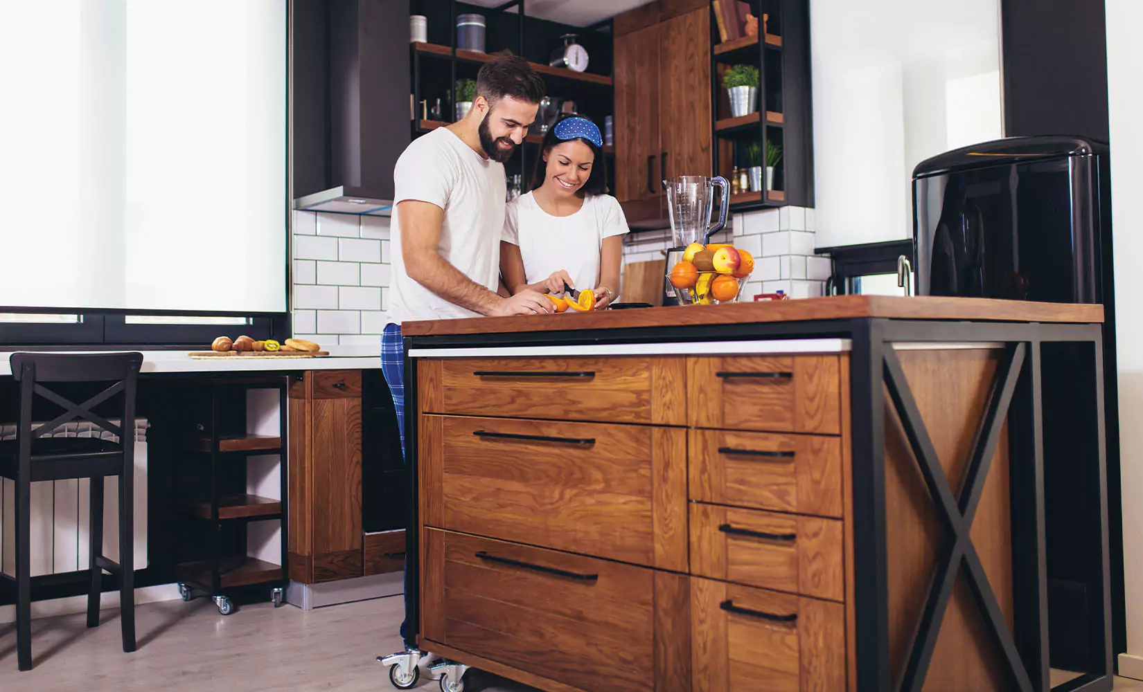 Kitchen with rolling kitchen island in center.