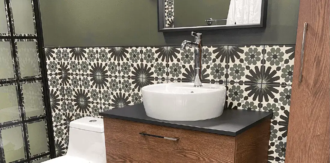 Bathroom with green tuscan-inspired tile.
