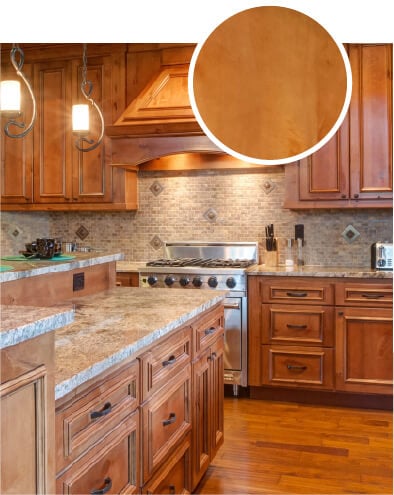 Maple kitchen cabinets in a darker brown stain and glazed finish.