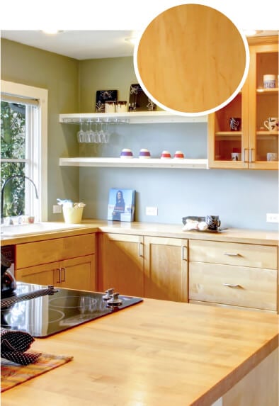 Open plan kitchen with light maple wood kitchen cabinets.