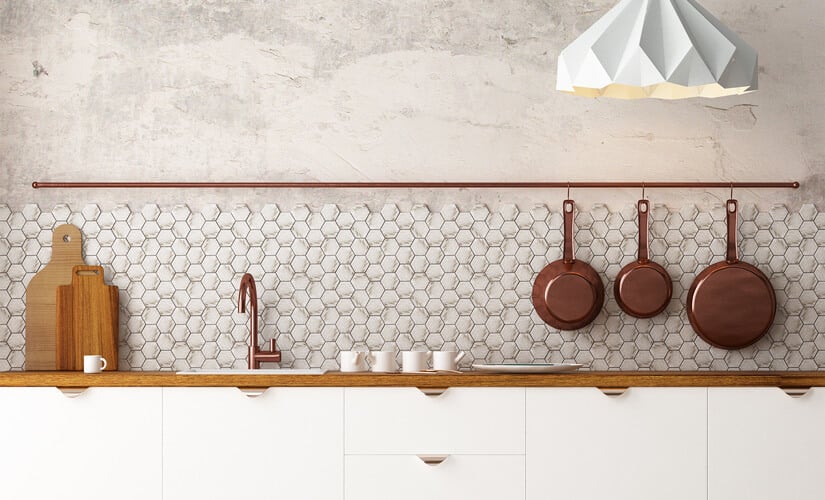Kitchen sink with small hexagon tile backsplash and simple hanging pan rack.