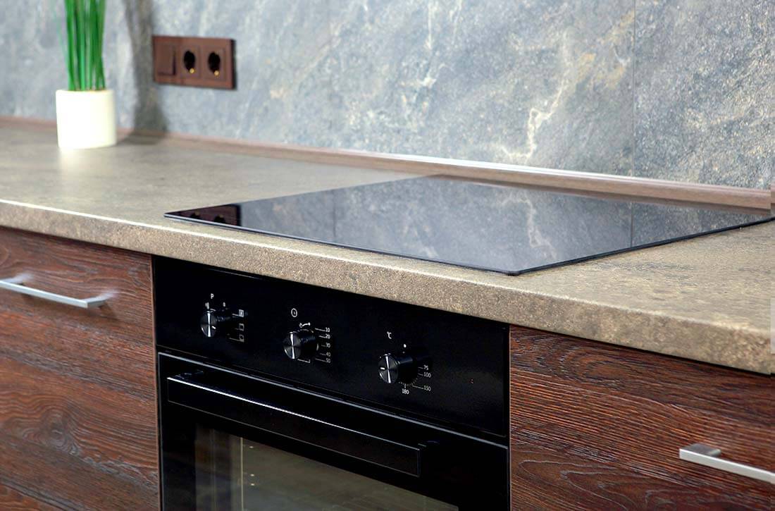 Seamless countertops in a sleek kitchen.