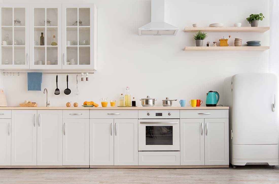 Open storage in a minimalist kitchen design.