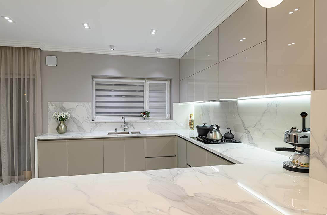 Marble kitchen countertops and matching backsplash,