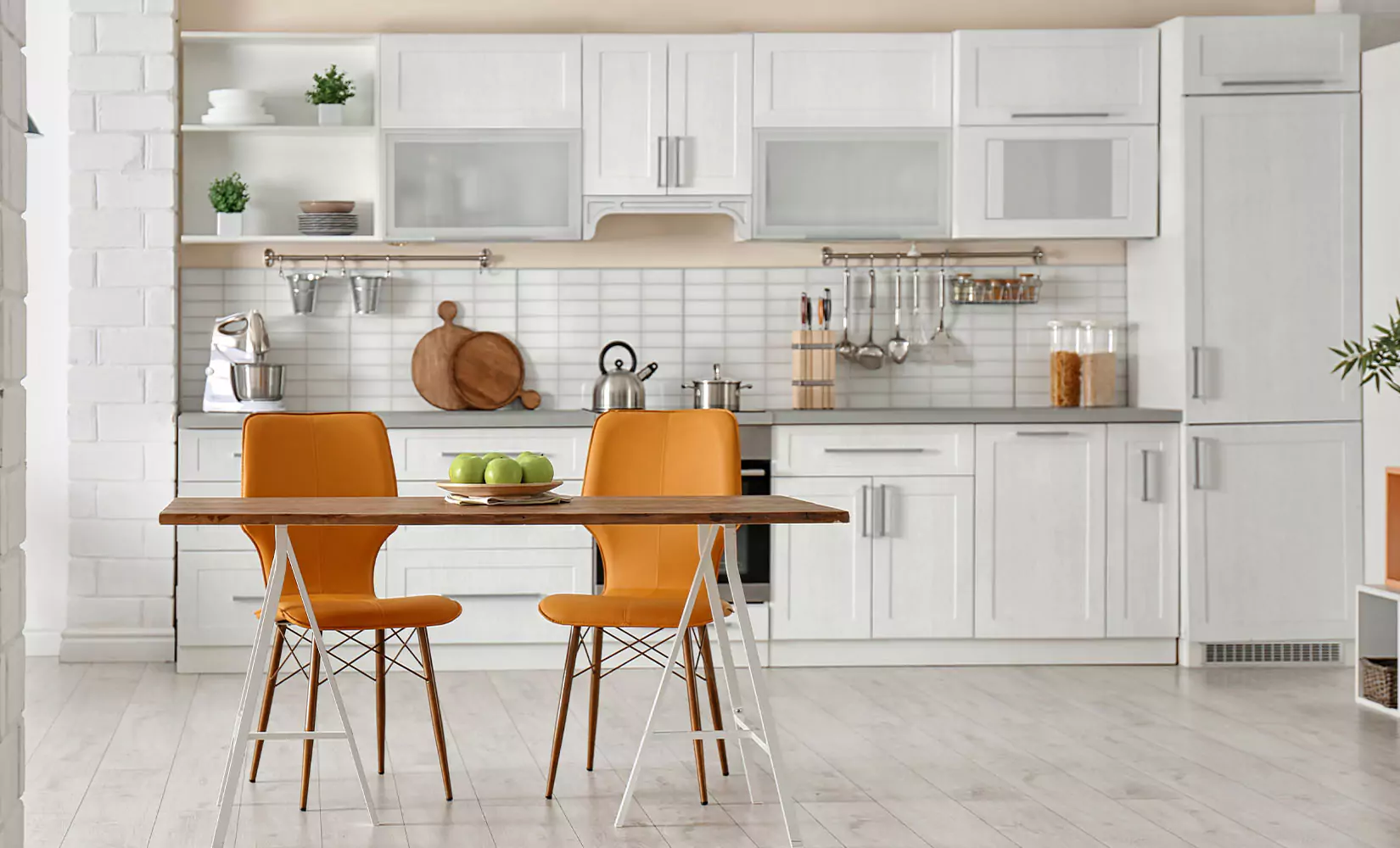 Single-wall kitchen layout with glass front upper cabinets.
