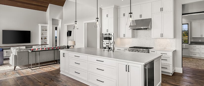 a sleek all-white kitchen with metallic hardware showcasing open concept kitchen design ideas