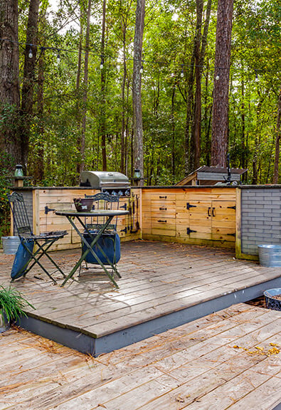 Outdoor kitchen on deck in the forest.