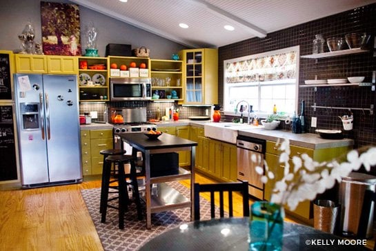 Lime green painted kitchen cabinets with black backsplash