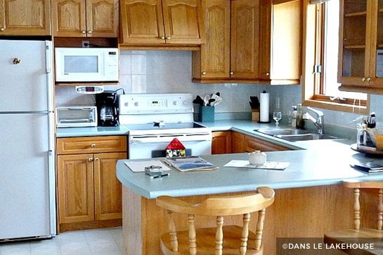 Wood cabinets with white appliances